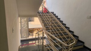 A staircase with metal railings leading to an upper floor.