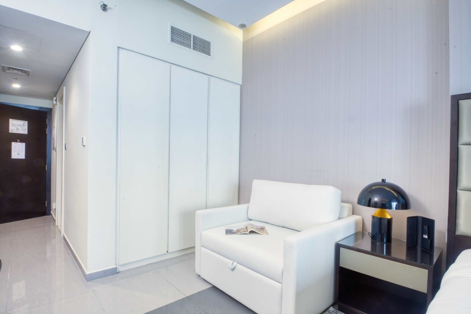Relax in style in this stylish, sunlit suite featuring a plush king-size bed, a comfortable lounge area, and a flat-screen TV.   