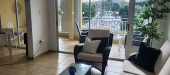 One level large villa apartment offering waterfront, and marina views.