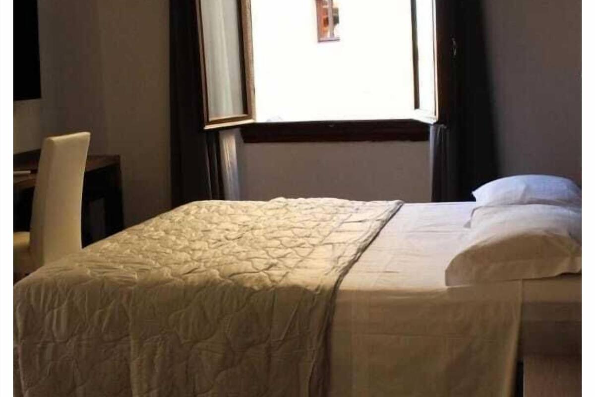 Standard Double Room, River View | Minibar, in-room safe, blackout drapes, iron/ironing board