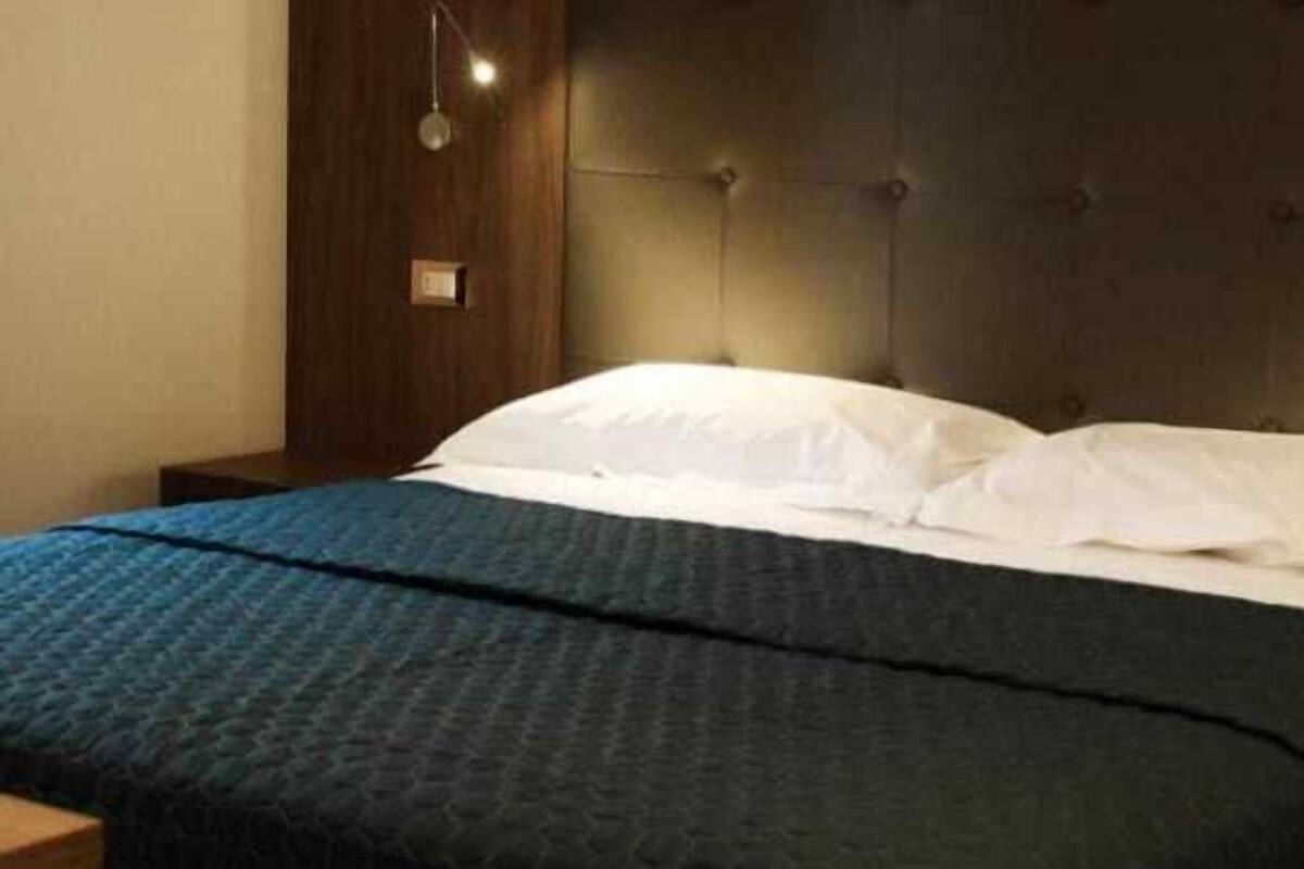 Deluxe Double Room, River View | Minibar, in-room safe, blackout drapes, iron/ironing board
