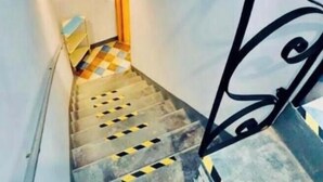 A staircase with a handrail, a patterned wall decoration, and a white ceiling. - 2 bedroom private vacation home in san feliciano, magione, perugia (San Feliciano, magione, Perugia)