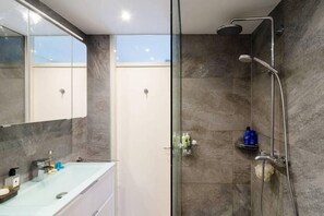 Shower, towels, soap, toilet paper