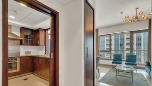 A modern apartment with a kitchen, dining area, and living room. - Bellavista-1BR-Full BurjKhalifa&Fountain (Dubai)