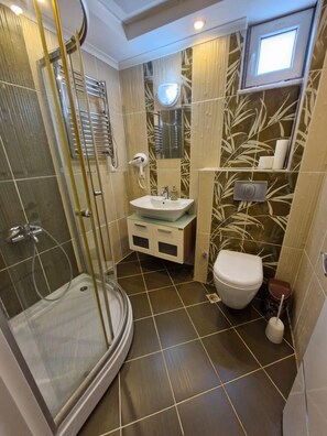 Shower, hair dryer, towels, soap