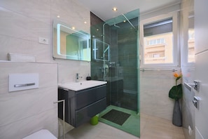 Shower, hair dryer, towels, soap