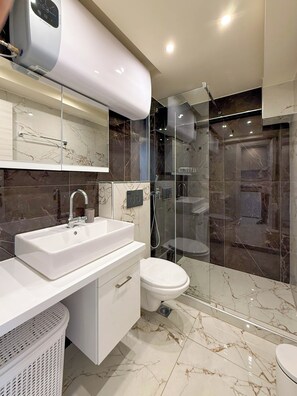 Shower, hair dryer, towels, soap