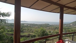 A room with a view of a coastal landscape, including hills and a body of water. - ACK Guest House Homabay (Homa Bay)
