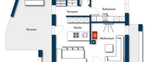 A floor plan with a terrace, kitchen, living room, bathroom, and a staircase.