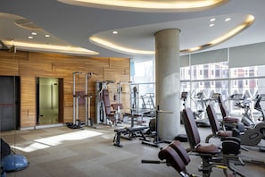 A gym with exercise equipment, large windows, and a modern design. - Nobel Zira Hotel (Belgrade)