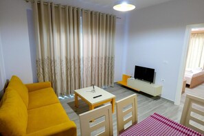 Deluxe appartement | Woonruimte | Een flatscreentelevisie