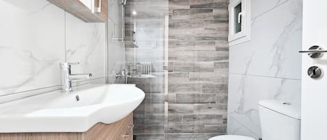Shower, hair dryer, towels, soap