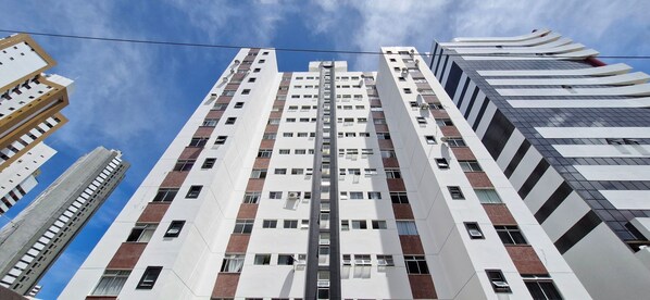 Experience the sleek, contemporary design of this high-rise building, featuring balconies with air conditioning and a unique panel pattern.