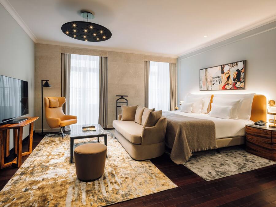Suíte luxo | Roupas de cama premium, frigobar (abastecido com itens grátis)