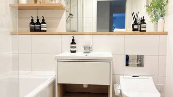 Hair dryer, bidet, towels, soap