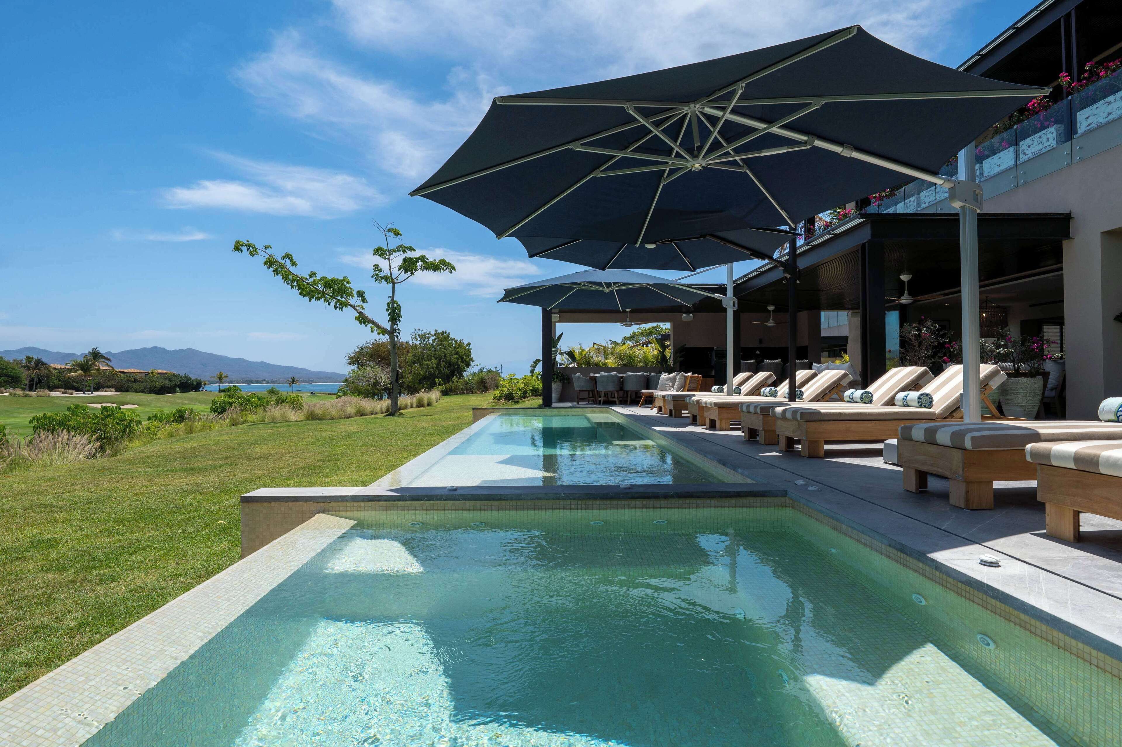 Outdoor pool, pool umbrellas, sun loungers