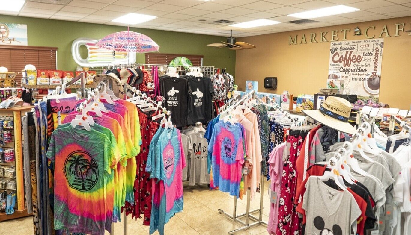 A clothing store with various t-shirts on display.