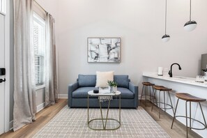 Living area - Evelyn 102 - A Cozy 1BR with 16ft Ceilings in Charming Forest Hill (Richmond)