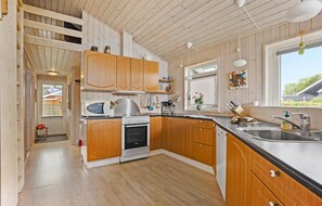 Fridge, stovetop, dishwasher, coffee/tea maker