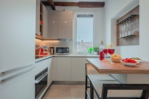 Departamento superior, vista a la ciudad | Cocina privada