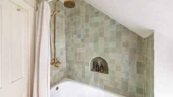 Shower, hair dryer, towels, shampoo
