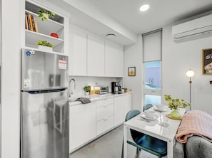 Fridge, microwave, stovetop, coffee/tea maker