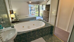 Shower, jetted tub, hair dryer, towels