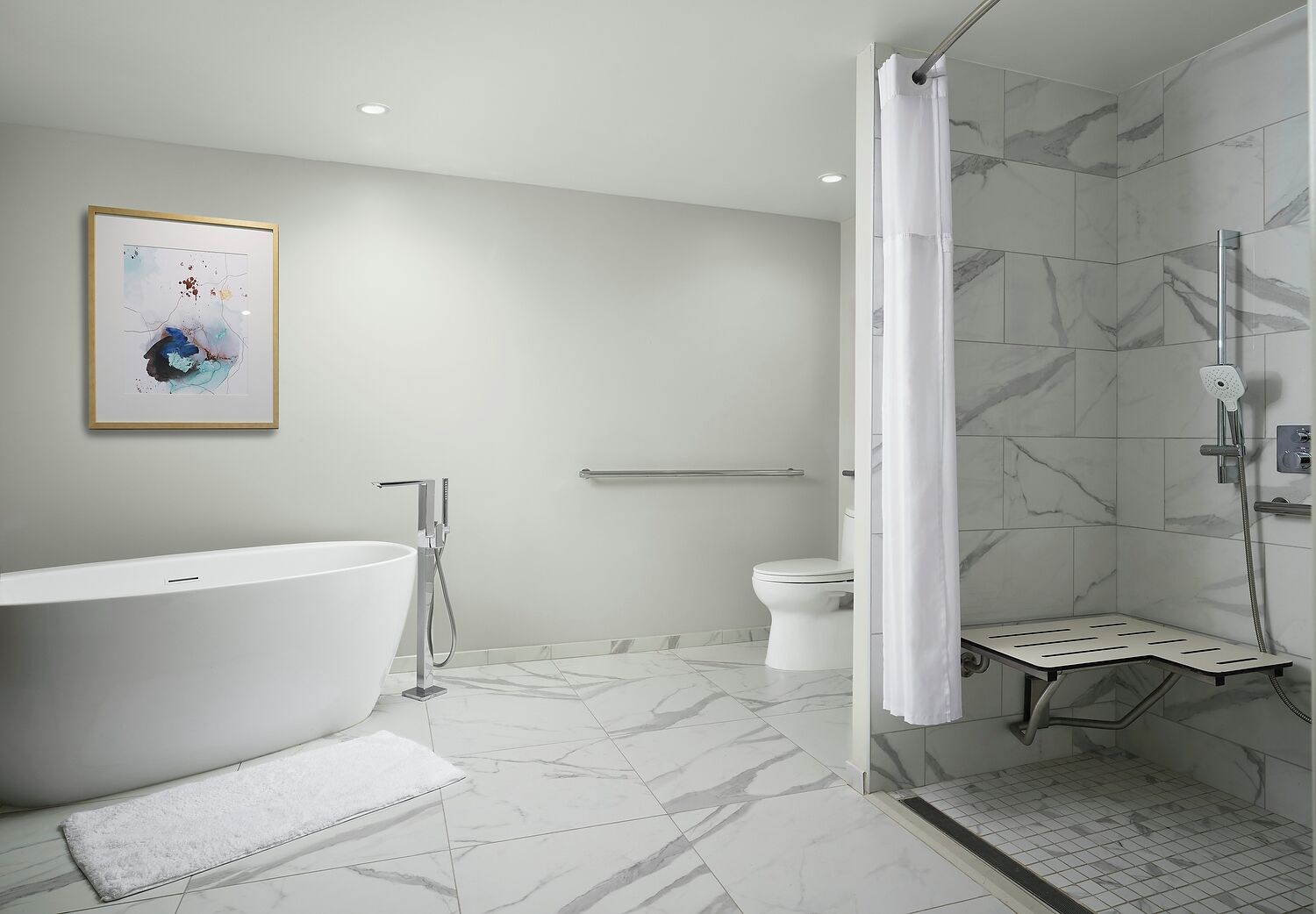 A modern bathroom with a freestanding bathtub, a shower enclosure, and a toilet.