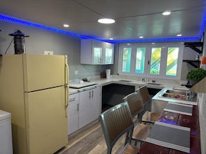 Fridge, coffee/tea maker, cookware/dishes/utensils