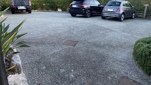 A parking area with three cars parked. - 1 bedroom apartment in quiet residence! Peaceful! & Always Sunny! (PROPRIANO)