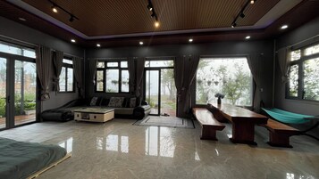 Standard Villa, 4 Bedrooms, Garden View | Living area | 60-inch Smart TV with satellite channels, fireplace
