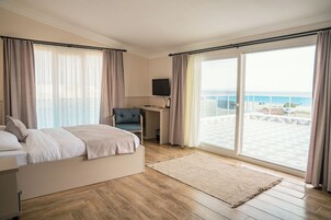 Deluxe Triple Room, Multiple Beds, Terrace, Sea View | Minibar, in-room safe, laptop workspace, soundproofing