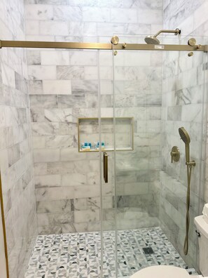 Shower, hair dryer, towels, soap