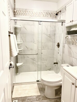 Shower, hair dryer, towels, soap
