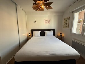 1 bedroom, desk, iron/ironing board, travel cot