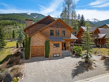 Exterior of Creekside Lodge, backing onto Greywolf Golf Course with ski-out access to Panorama Mountain Resort.