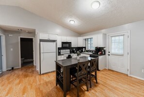 Coffee/tea maker, fridge, microwave, oven