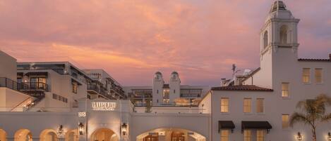 A hotel with a prominent entrance, a bell tower, and a sign reading "LABAHIA HOTEL & SPA".