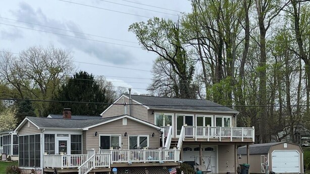 A two-story house with a front deck and a garage. - The ShellHunter getaway at Fairview Beach. The perfect place to disconnect. (King George)