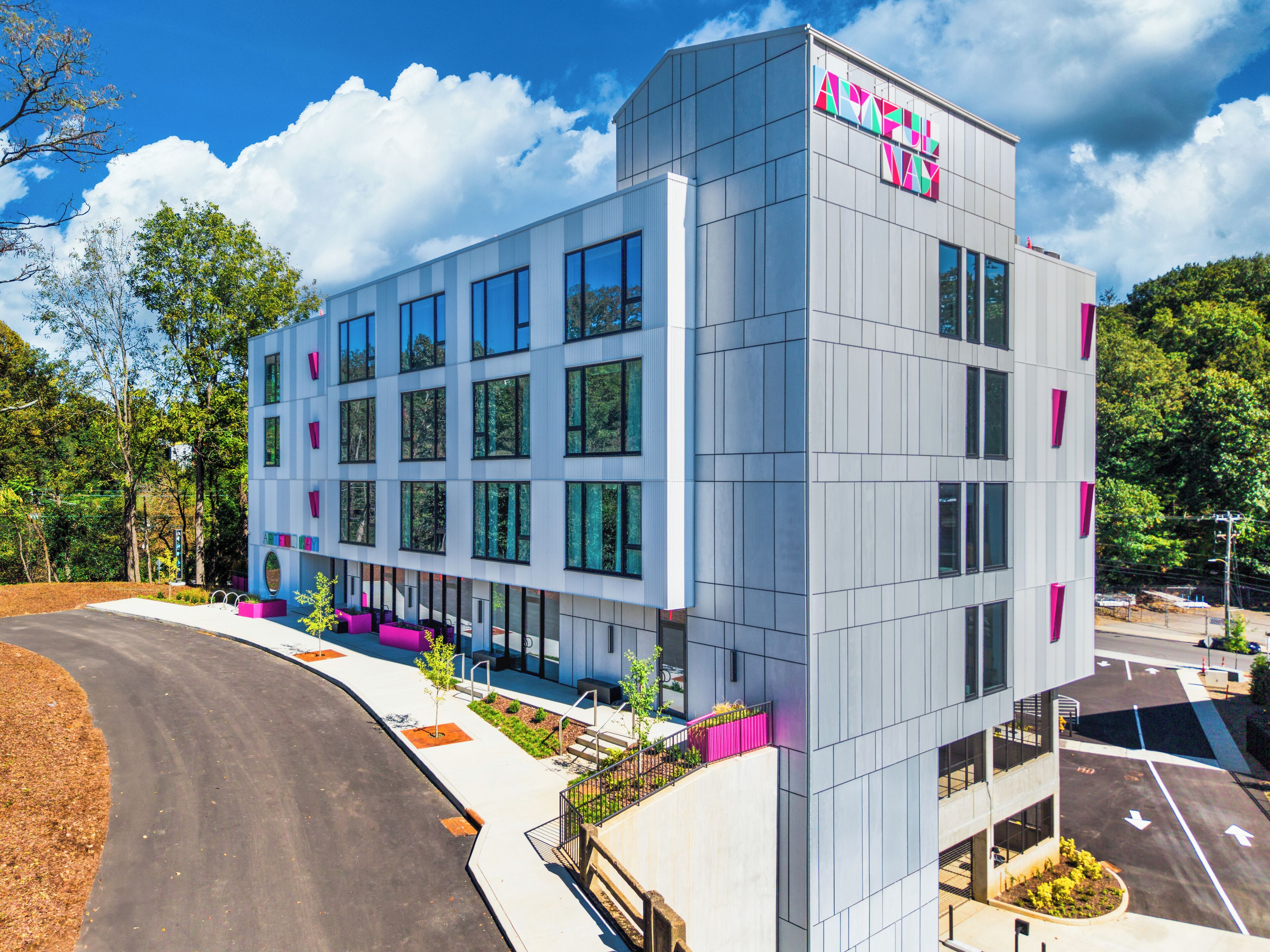 A modern building with a sign reading "ACCURATE WAY".