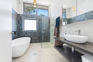 Shower, hair dryer, towels, shampoo