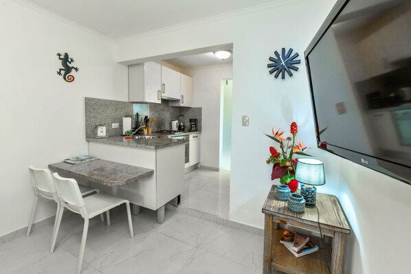 Fridge, oven, coffee/tea maker, cookware/dishes/utensils