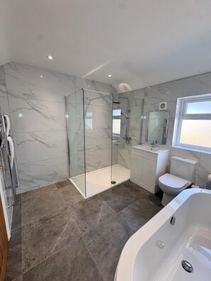 Shower, hair dryer, towels, soap