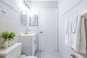 Hair dryer, towels, soap, shampoo