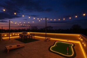 Outdoor dining - Luxury 6BR/6BA Indy Home w/ Rooftop Views of Lucas Oil, Arcade, Office & Hot Tub (Indianapolis)