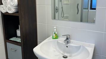 Shower, hair dryer, towels, soap