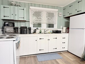 Fridge, microwave, stovetop, coffee/tea maker