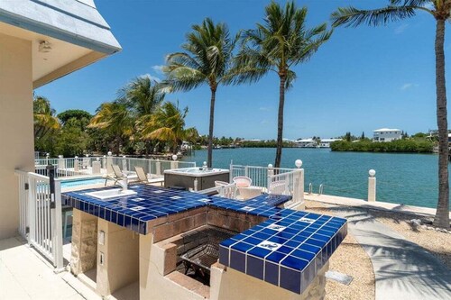 Blue Marlin House ~ Waterfront Pool Home, Steps from the Beach, Hot Tub, 210' Dock