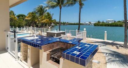 Blue Marlin House ~ Waterfront Pool Home, Steps from the Beach, Hot Tub, 210' Dock