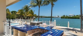 Blue Marlin House ~ Waterfront Pool Home, Steps from the Beach, Hot Tub, 210' Dock